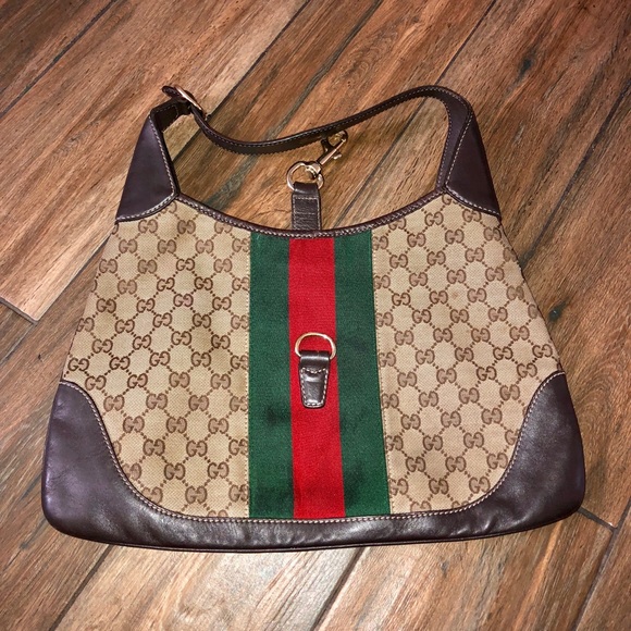 Gucci Handbags - Gucci Hand bag monogram leather and canvas.